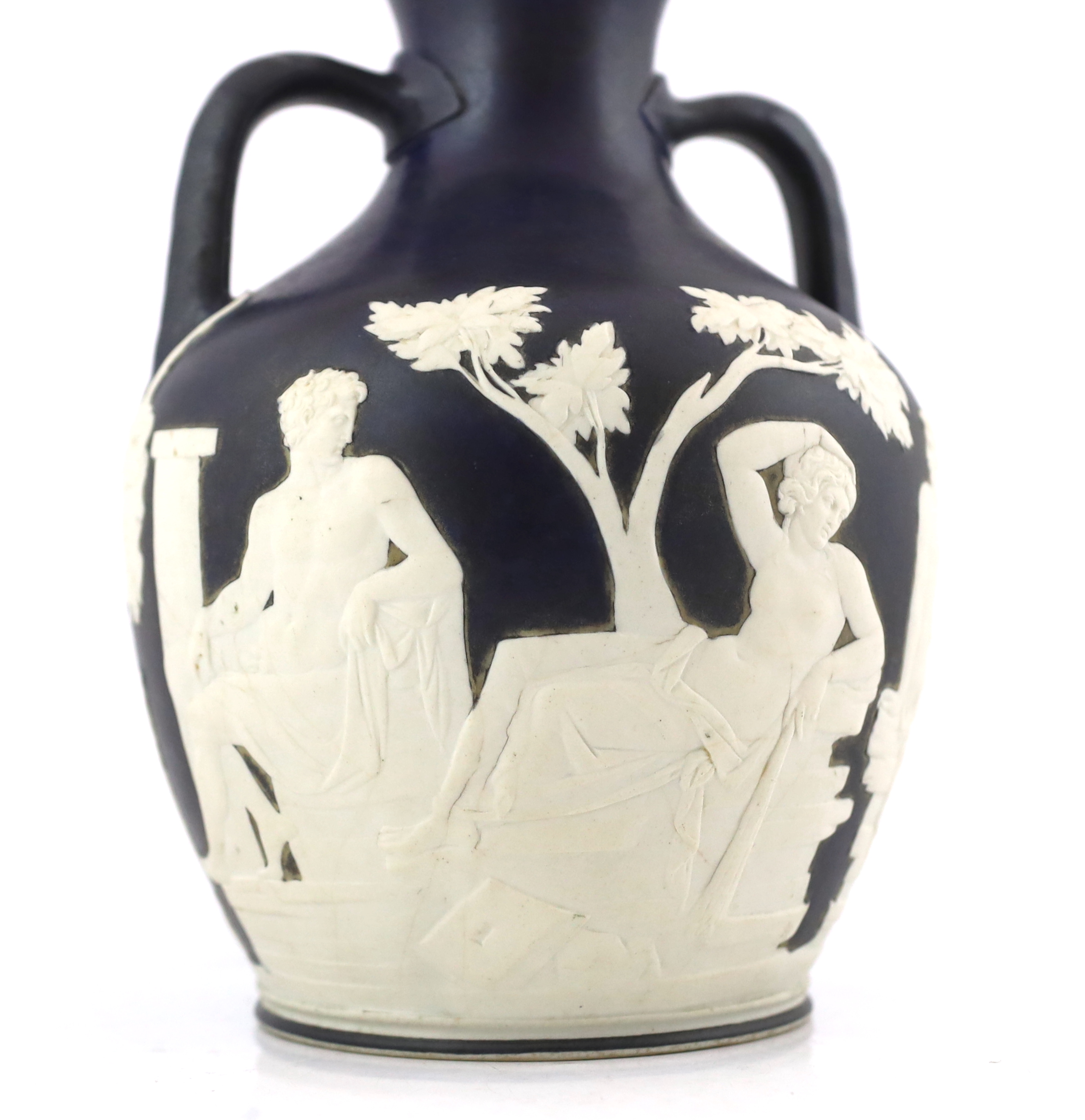 A Wedgwood dark blue glazed and white sprigged replica of the Portland vase, late 19th century